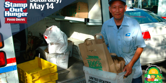 letter carrier collecting food drive donations in mail truck
